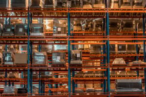 boxes and containers on shelves in modern warehouse
